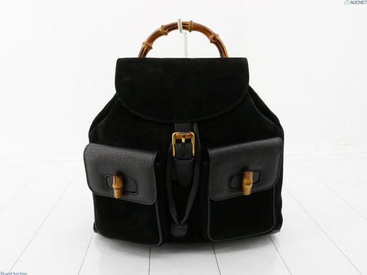 Gucci black suede backpack with bamboo handle and gold hardware