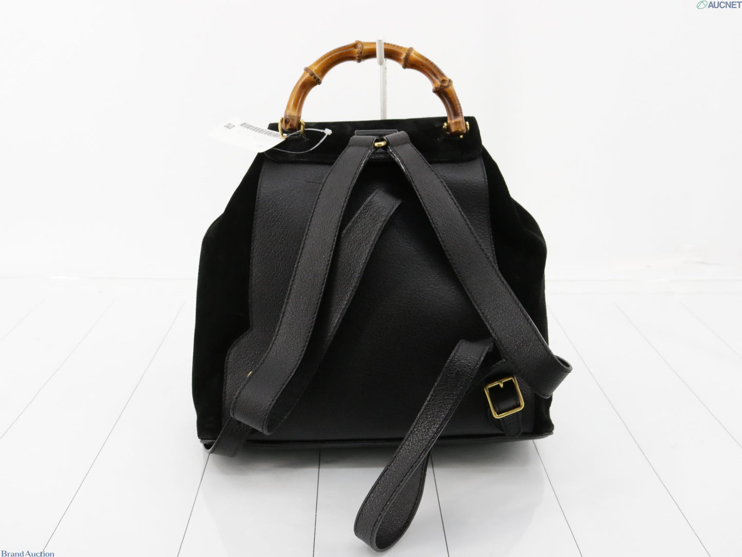 Gucci black suede backpack with bamboo handle and gold hardware