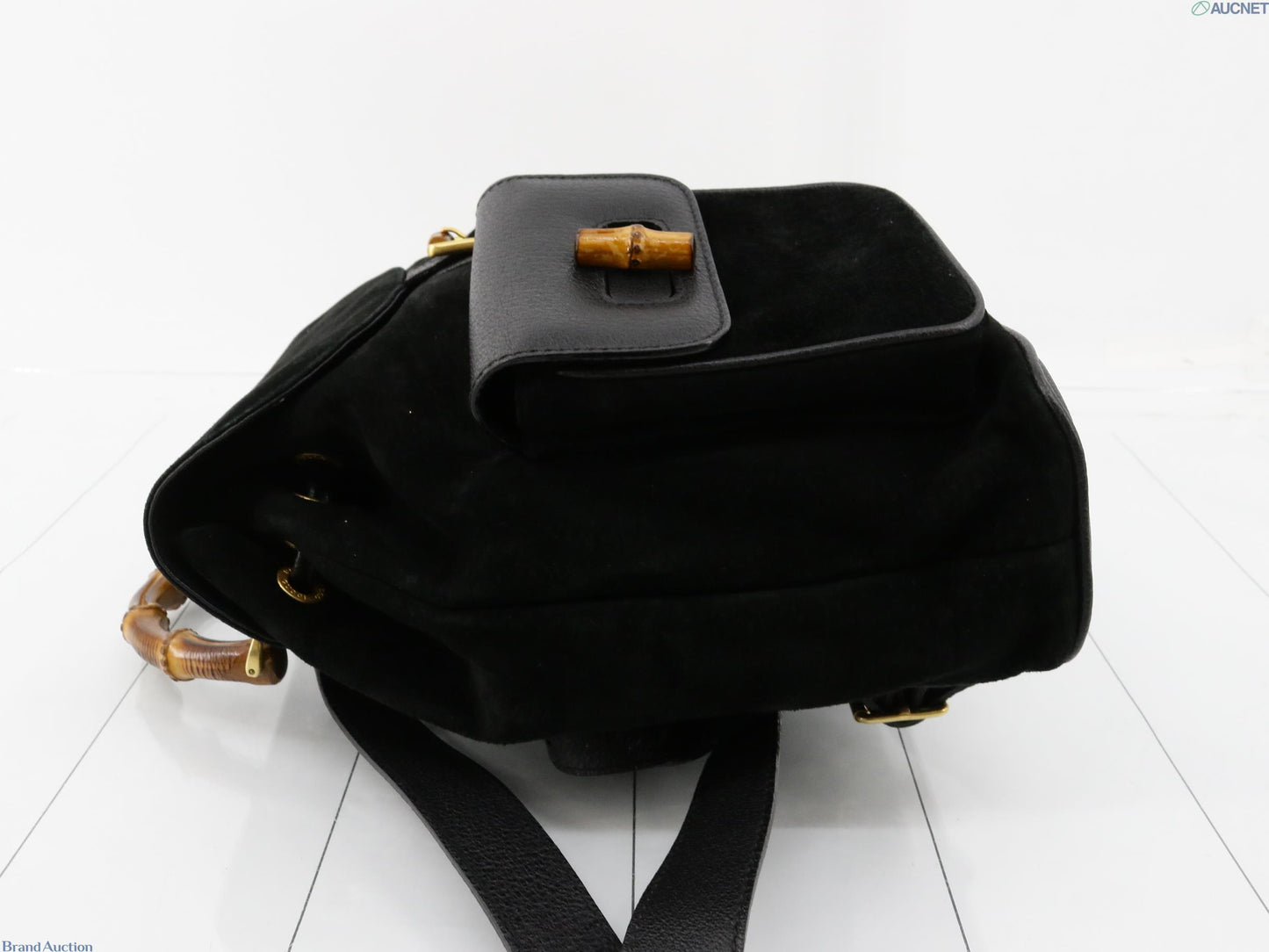 Gucci black suede backpack with bamboo handle and gold hardware